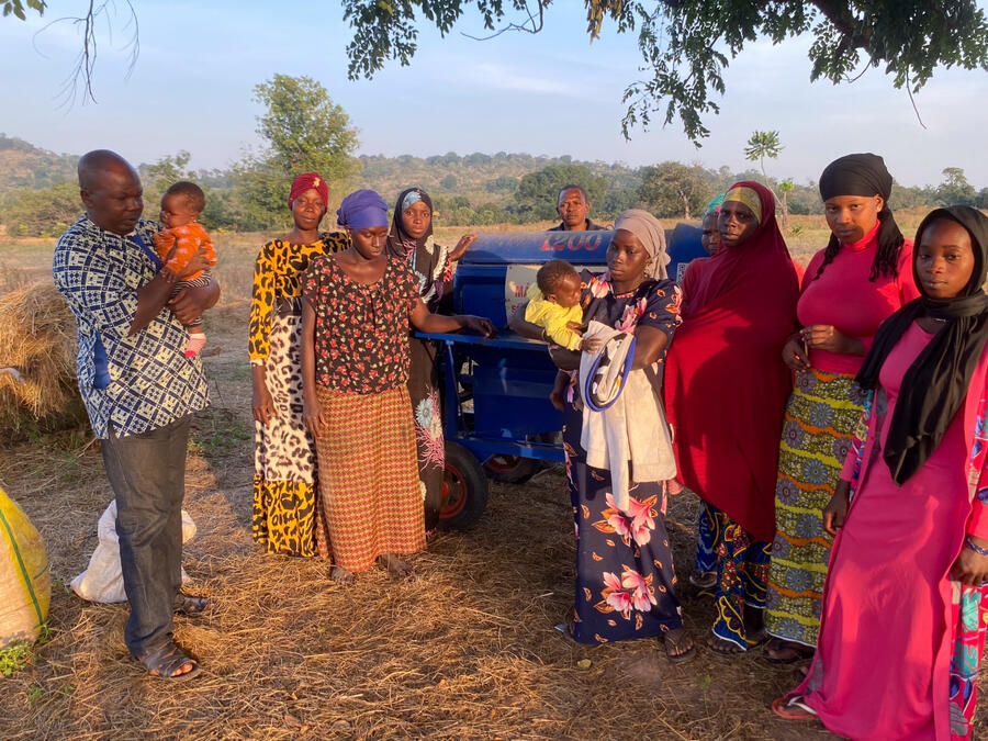 Women of the farmer co-op with their threshing machine in Guinea